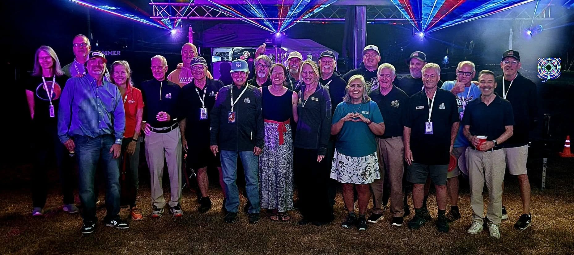 Twenty-one people gathered beneath colorful laser lights at the 2026 World Disc Golf Hall of Fame induction at USDGC.